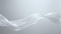 Flowing white silk fabric waves across neutral gray background, creating elegant abstract motion and smooth curves for modern design projects.