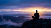Silhouette of person meditating on mountain peak during sunrise with dramatic purple and orange sky. Peaceful mindfulness and spiritual wellness concept.
