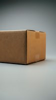 Brown cardboard shipping box with tape seal on neutral background for packaging and delivery concepts.