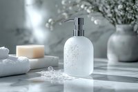 White ceramic soap dispenser with chrome pump on marble bathroom counter with towels and flowers for luxury spa decor and personal care routines.