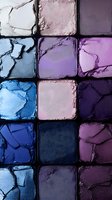 Crushed eyeshadow palette featuring shimmering blues, purples, and pinks arranged in square pans, showing texture and pigmentation of luxury cosmetic products.