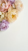 Soft pastel peony flowers in pink, cream and lavender tones arranged on light background with copy space for wedding invitations and feminine designs.