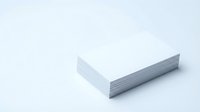 Stack of white blank paper sheets on clean background for office supplies and printing materials.