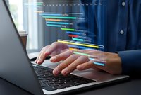 Professional businessman hands typing on laptop with holographic project management timeline chart displaying colorful progress bars and scheduling data.