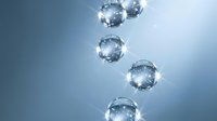 Clear water bubbles floating upward through blue liquid creating refreshing aquatic atmosphere for spa wellness and hydration concepts.