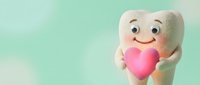 Cute tooth character holding pink heart on soft green background for dental care and oral health awareness campaigns.