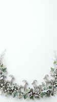 Decorative goat figurines surrounded by fresh greenery and dried branches arranged on white background, isolated and ready for design use on invitations, greeting cards, posters, and digital projects.