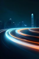 Dynamic light trails curve through modern cityscape at night with glowing blue and orange streaks against dark urban skyline featuring illuminated skyscrapers.