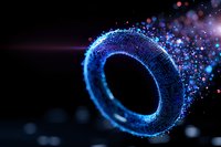 Glowing blue ring shape with sparkling particles and bokeh effects against dark background creates magical atmosphere for fantasy designs and backgrounds.