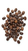 Roasted coffee beans scattered on white background, isolated for cafe menu design, beverage branding and culinary projects.