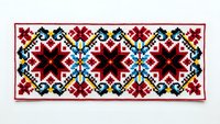 Traditional folk embroidery pattern with geometric floral motifs in red, blue, and black colors on white background for textile design and crafts.