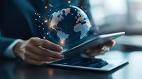 Digital hologram globe floating over tablet device in hands, showing worldwide network connections and data exchange in modern business environment.