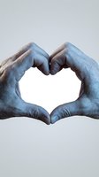 Blue painted hands forming heart shape gesture on white background isolated for love and unity concepts.
