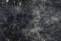 Dark scratched surface with worn texture and distressed marks creating abstract grunge pattern on black background, suitable for overlay designs and textures.