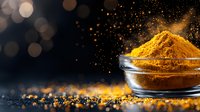 Ground turmeric powder in glass bowl with magical golden sparkles on dark background, aromatic spice scattered on black surface with bokeh lights.