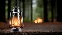 Vintage oil lantern glowing warmly on wooden surface with blurred forest background, creating cozy camping atmosphere for outdoor adventures.