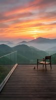 Wooden chair on modern deck overlooking misty mountain landscape at golden sunrise, ideal for travel, lifestyle, and hospitality design projects.