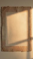 Aged kraft paper with raw deckled edges and warm sunlight casting geometric shadow across surface, suitable for vintage backgrounds, design mockups, and nostalgic projects.