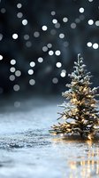 Small Christmas tree with warm lights on snowy ground against dark bokeh background. Festive winter holiday decoration with golden illumination and sparkles.