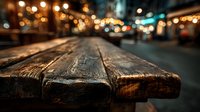 Rustic wooden table surface with blurred city street lights and bokeh background for product display and commercial advertising presentations.
