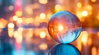 Crystal ball reflecting urban cityscape with glowing bokeh lights and sunset colors, magical sphere on reflective surface creates dreamy atmosphere.