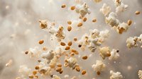 Popcorn kernels and fluffy white popped corn floating in air against soft beige background. Snack food concept for movie night and entertainment themes.