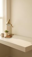 Minimalist home office desk setup with brass task lamp, succulent plant, coffee mug and notebook in warm neutral tones for productivity and workspace design.