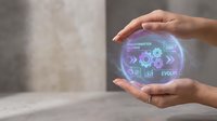Hands holding glowing holographic sphere with digital business icons including gears, graphs, and evolution text representing technology innovation and digital transformation strategy.