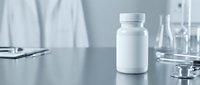 White medicine bottle with pills on laboratory table surrounded by medical equipment and stethoscope in clean clinical environment for healthcare research.