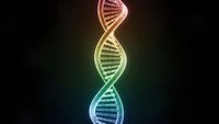 Glowing DNA double helix structure with vibrant rainbow colors against dark background for genetic research and biotechnology presentations.