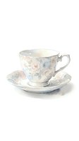 Watercolor teacup and saucer with delicate rose pattern in soft pastel colors isolated on white background for vintage tea party designs.