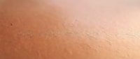Macro close-up of human skin texture showing natural pores and surface details. Suitable for dermatology, skincare product marketing, beauty tutorials, and medical educational materials.