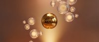 Golden spheres floating in warm bronze space with glowing translucent bubbles creating luxury abstract composition for modern design projects.