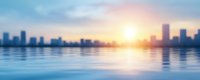 Blurred panoramic cityscape with modern skyscrapers silhouettes reflecting in calm water during sunrise. Soft focus urban waterfront view with warm sunlight.