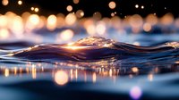 Mesmerizing water wave with golden bokeh lights reflecting on surface, macro photography capturing liquid motion and light interplay at sunset hour.