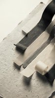 Traditional woodworking chisel tools on wooden workbench surface for carpentry and furniture making craftsmanship projects.