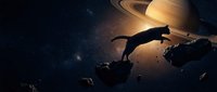 Astronaut floating in deep space near Saturn with dramatic lighting and asteroid field creating cinematic sci-fi atmosphere for futuristic concepts.