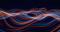 Dynamic flowing light trails in orange and blue creating abstract wave patterns on dark background for modern digital design projects.