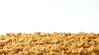Isolated couscous grains on white background, ready for food styling, culinary design, recipe blogs, cooking websites, and restaurant menus.