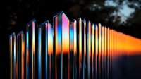 Iridescent crystal prisms arranged in row creating rainbow light effect against dark background, displaying spectrum colors from blue to warm orange in gradient pattern.