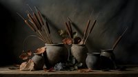 Ancient pottery vessels filled with wooden arrows and spears arranged on rustic surface with autumn leaves creating atmospheric medieval weaponry display.