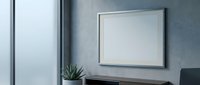 Modern office interior with blank white frame on gray wall, succulent plant on dark desk, contemporary workspace design for mockup presentations.