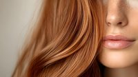 Close up view of glossy lips and flowing copper red hair against neutral background, showcasing natural beauty and modern cosmetic trends in soft lighting.
