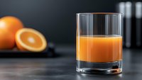 Fresh orange juice in clear glass with whole and cut oranges on dark background, minimalist food photography composition for healthy lifestyle and beverage concepts.