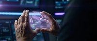 Hands holding glowing holographic brain interface with neural network visualization for artificial intelligence, technology, and digital innovation concepts.