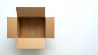 Open empty cardboard shipping box with flaps extended on white background, ready for packaging and delivery services.