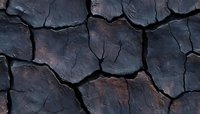 Dark cracked earth texture with deep fissures and rusty undertones, showing natural drought patterns and geological formations in dramatic detail.
