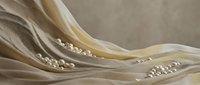 Elegant flowing fabric waves with pearl beads creating luxurious textile movement in soft beige and cream tones for wedding and fashion design projects.