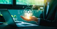 Business professional holding glowing digital team icons representing human resources management and corporate leadership in modern office environment.