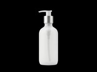 Clear liquid soap dispenser bottle with silver pump top, isolated on transparent background. Ready for design use on product packaging, labels, print-on-demand items, and digital designs.